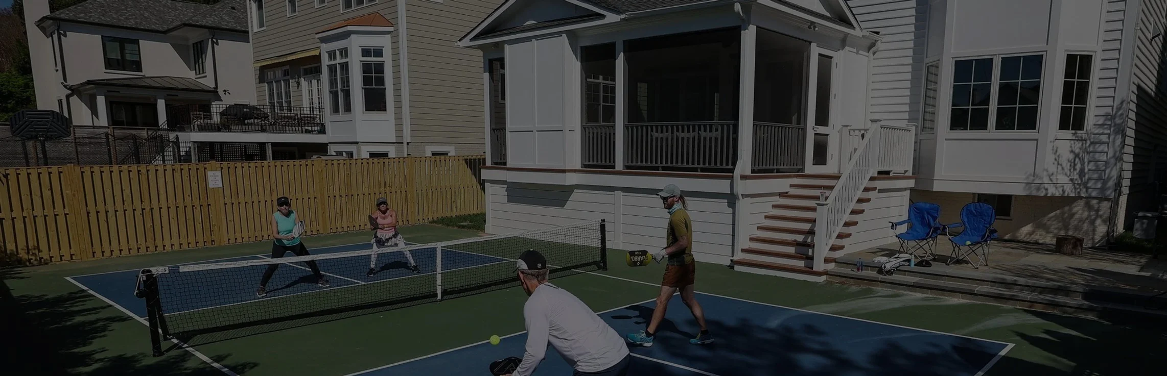A group of people playing pickleball