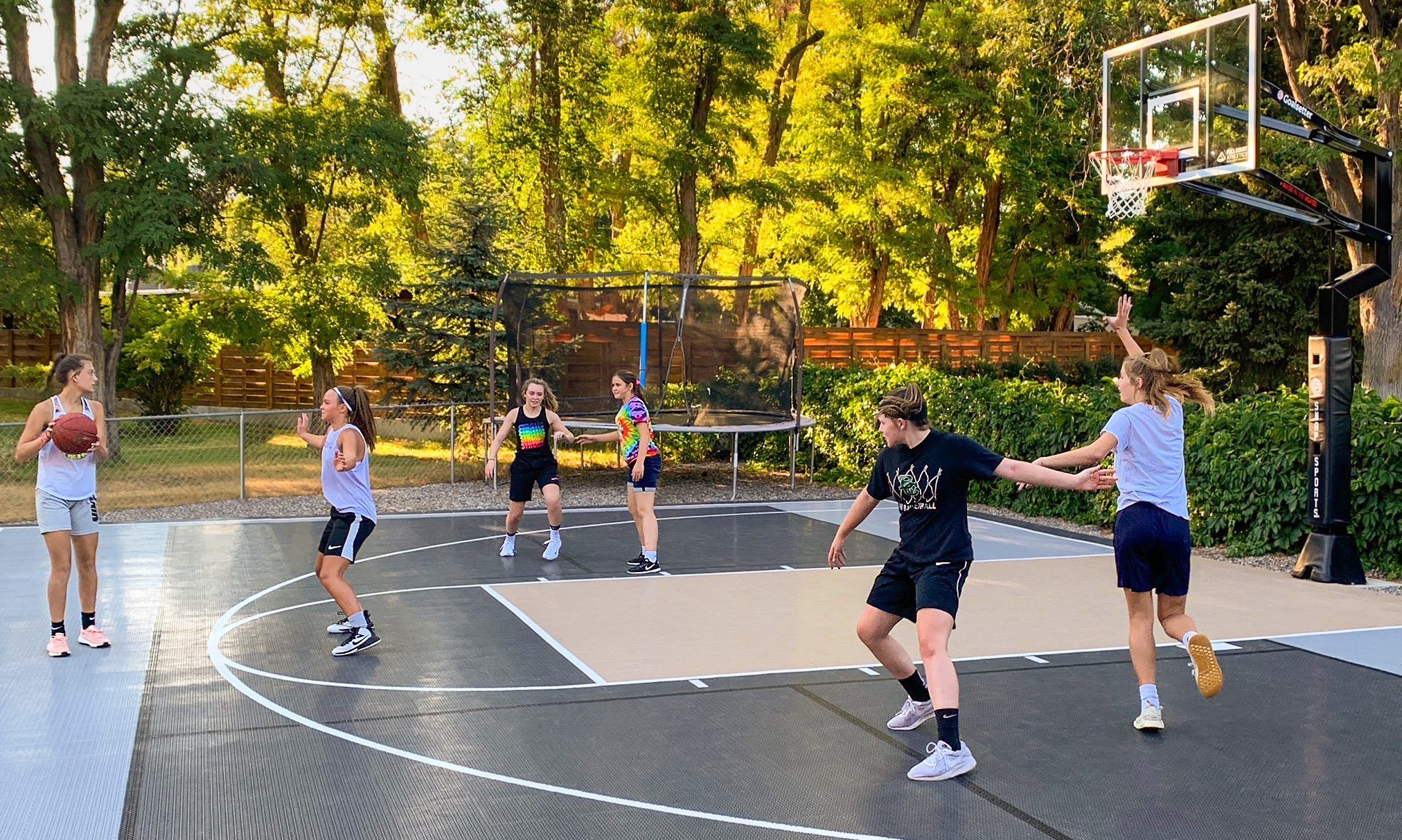 A group of people playing pickleball