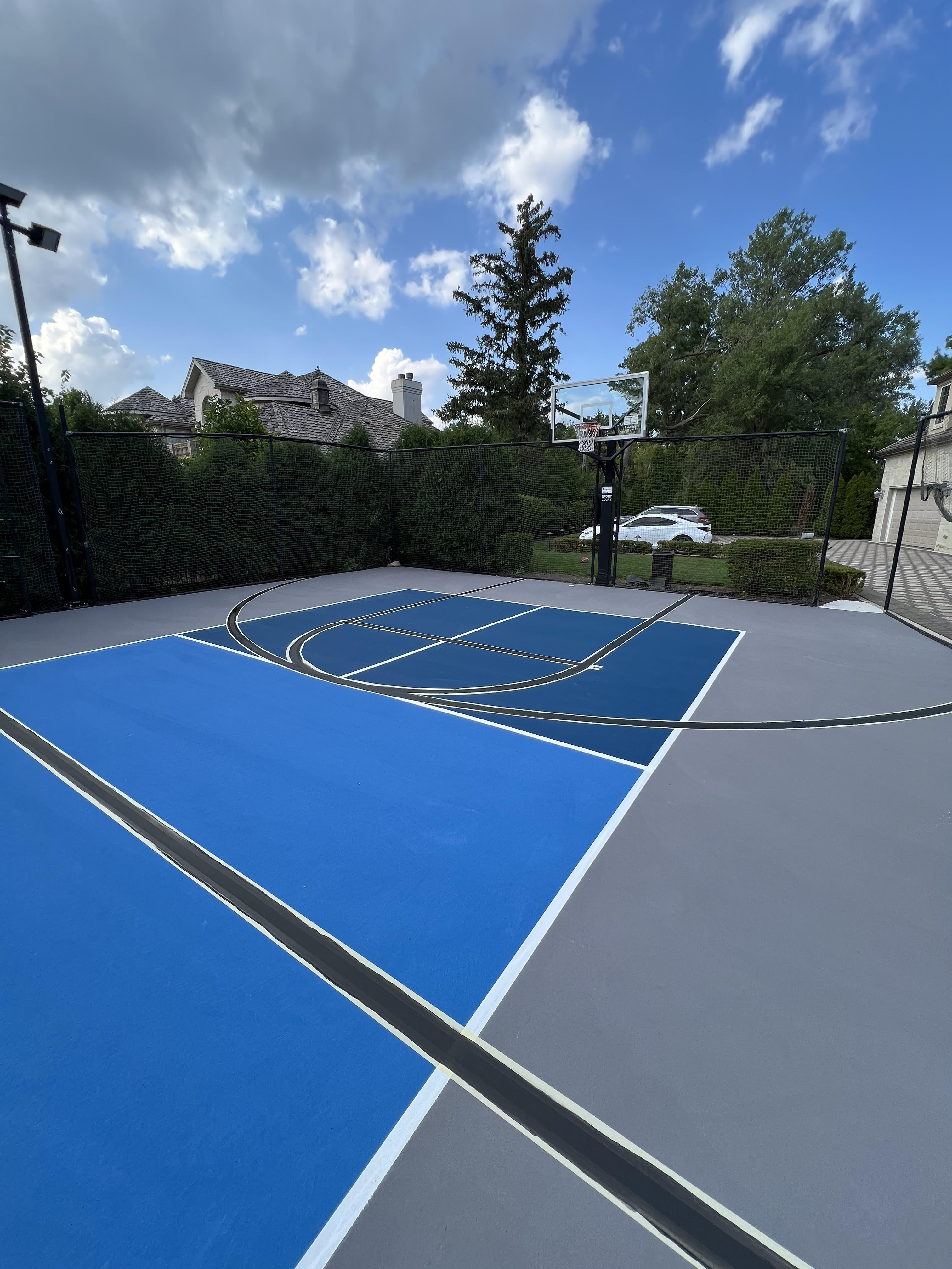 A residential pickleball and basketball court